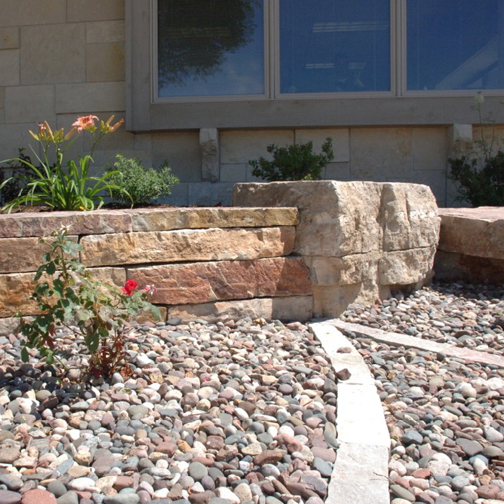 Character boulder in stacked stone wall
