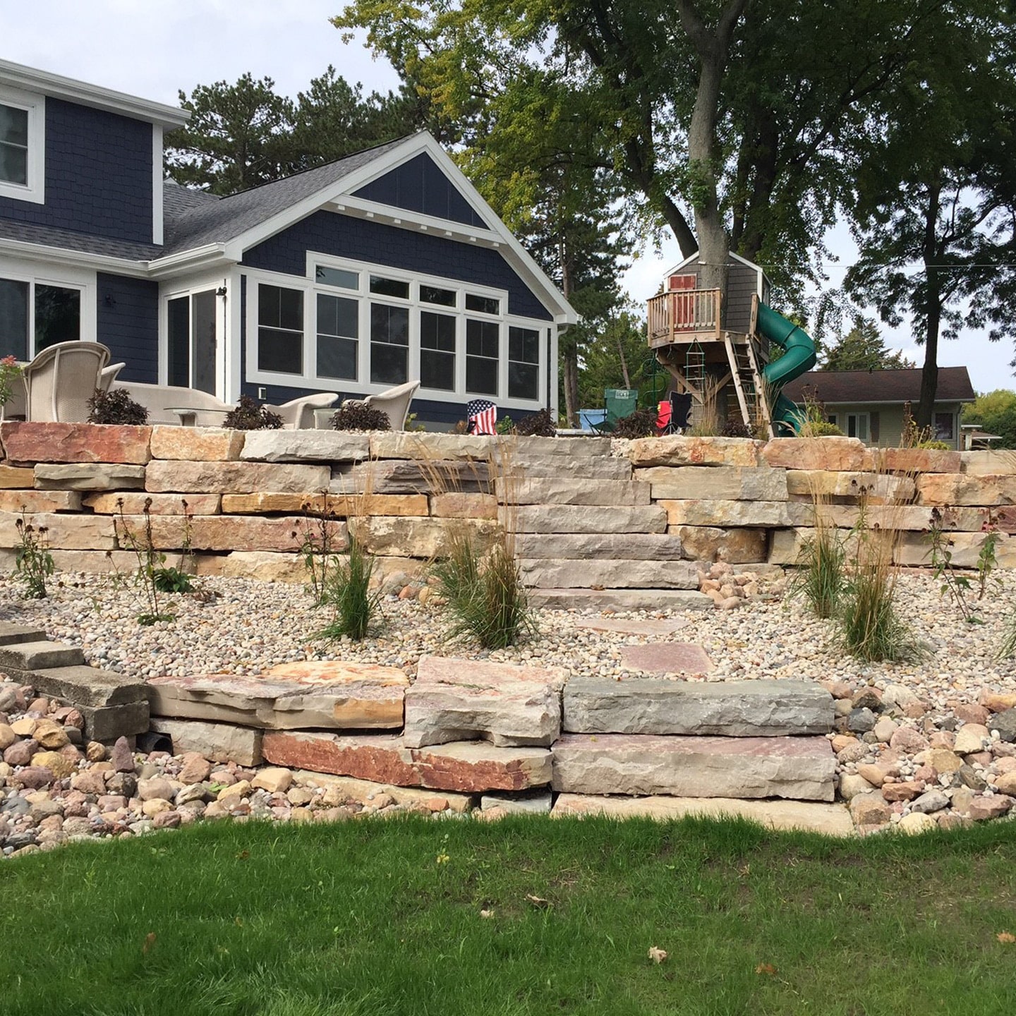 Chilton wall stone in a large backyard elevatted landscape