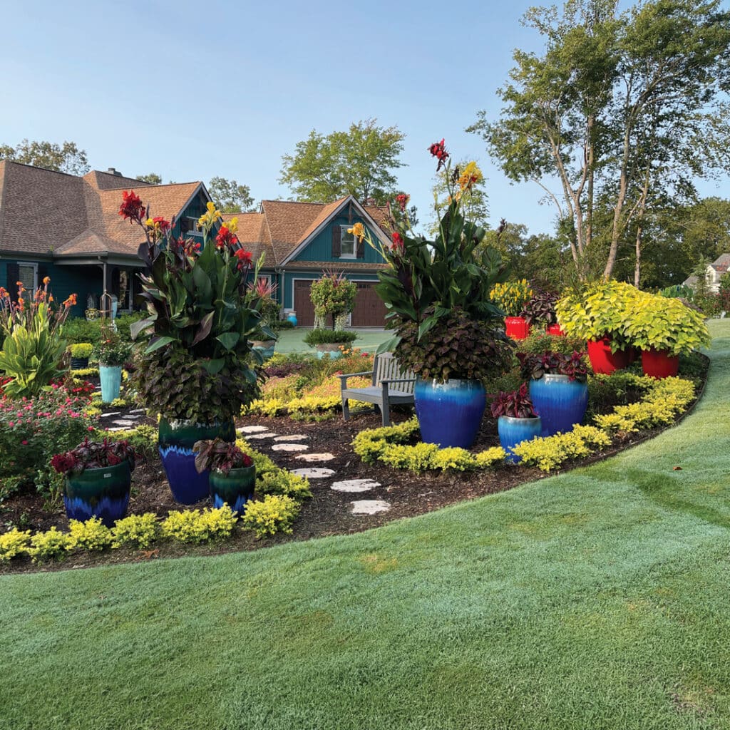 Garden filled with beautiful and colorful plants and pottery