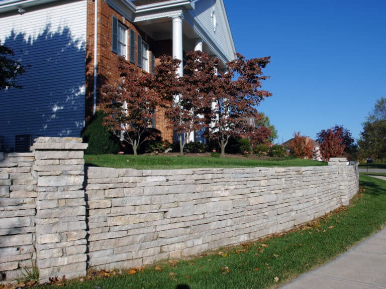 Large natural stone wall on residential property