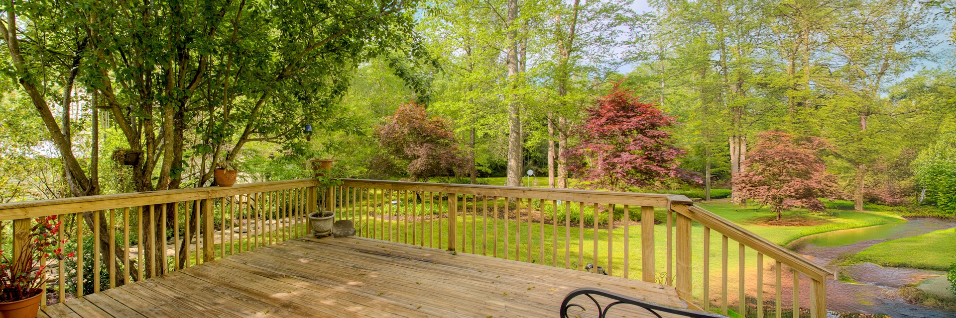 Trees shading a deck and yard area